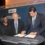 Minister of Energy and Energy Affairs  Mr Kevin Ramnarine as he signs the MOU